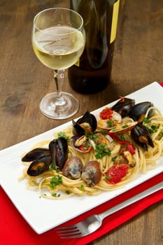 photo of delicious pasta with clams and mussel