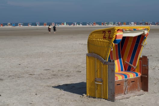 hooded beach chair with more beach chairs in the background