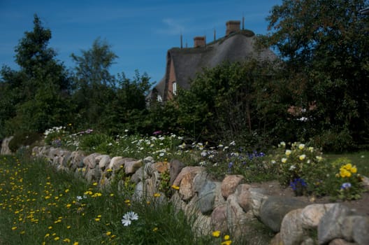 private thatched-roof house with garden on the island of Amrum, Germany
