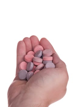Handful of Antacid tablets on a white background