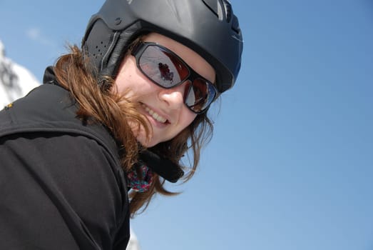 Portrait - Young woman with ski helmet