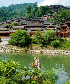 Ethnic Chinese Miao village near a river in rural China