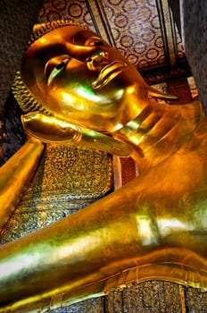 The large famous reclining buddha at a temple in Bangkok