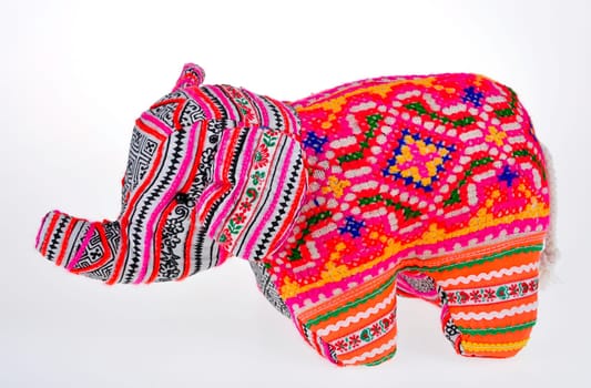 A colorful stuffed elephant isolated on white background