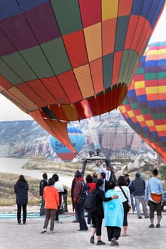 Goreme, Cappadocia, Turkey: June 2011 - flyeres queueing to board into in a hot air ballon