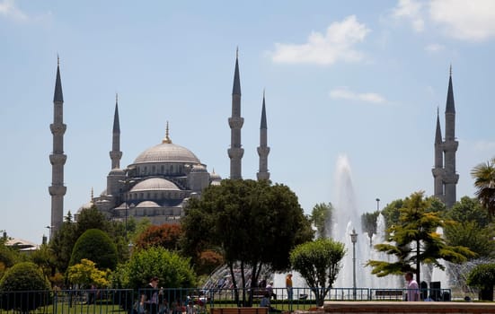Istanbul, Turkey: June 2011 - The Blue Mosgue its gardens and fountains with public relaxing in its park and gardens
