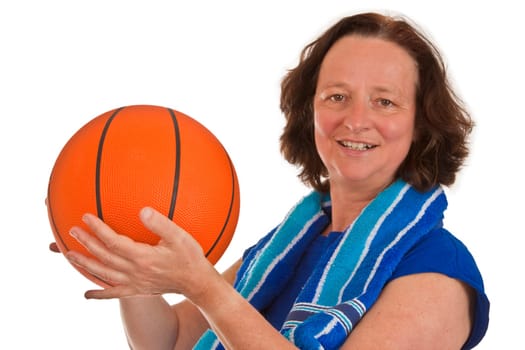 Middle-aged woman with basketball isolated on white background