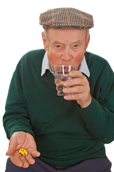 Senior taking tablets - isolated on white background
