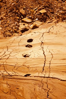 Vertical view of mountain ground, rendered in post production as Mars surface
