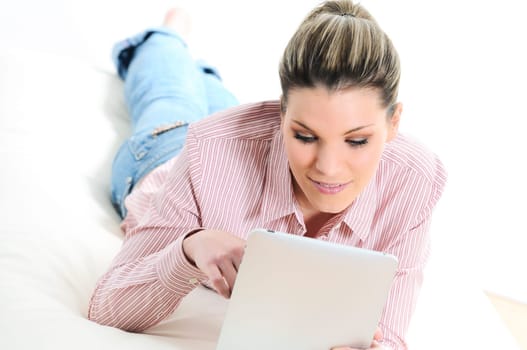 Young woman surfing on his digital tablet