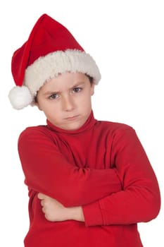 Frowning boy with santa hat isolated on white background