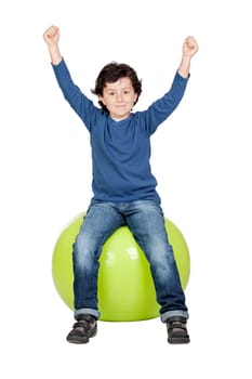 Child sitting on a pilates ball isolated on a over white background
