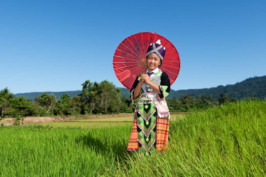 Portrait of Hmong of Laos,with parasol and traditional costume
