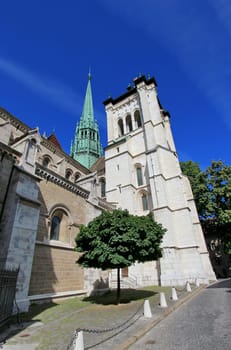 Side of protestant Saint-Peter&#039 s cathedral in Geneva, Switzerland, by beautiful weather. The construction started in 1160 and lasted about one century. After that, it&#039 s been modified several times, sometimes because of fire. At XVI century, when
