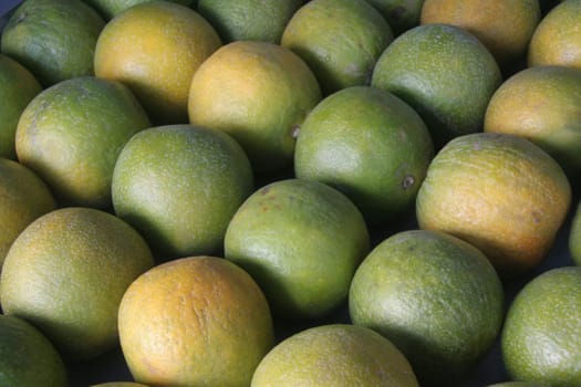 Neatly stalked sweet lemon fruits in a stall Uploaded on 25aug11