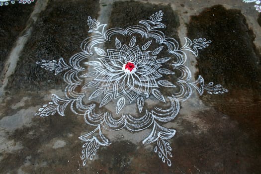Rangoli is the art of drawing designs using stone powder