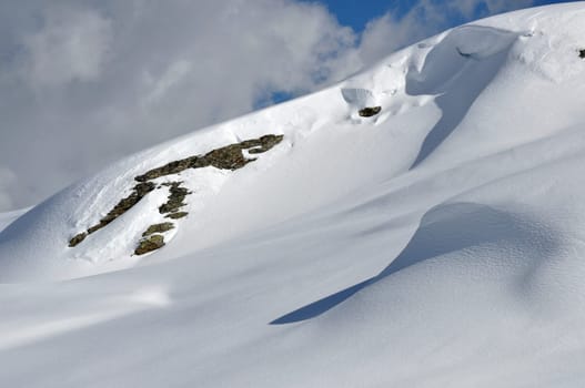 snow and rock on smooth slopes