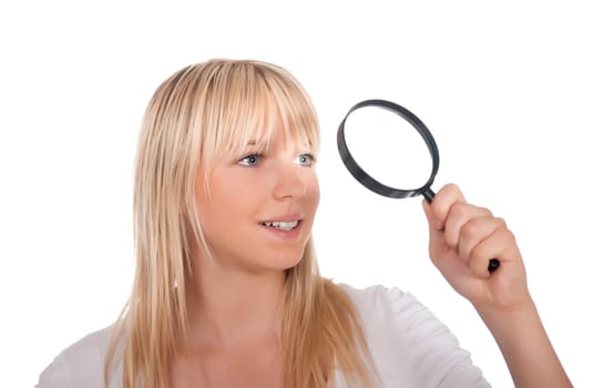 Blonde young woman with magnifying glass