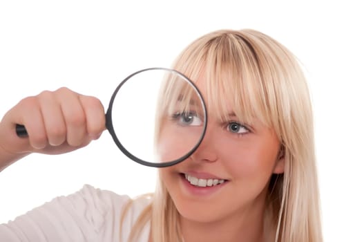 Blonde young woman with magnifying glass