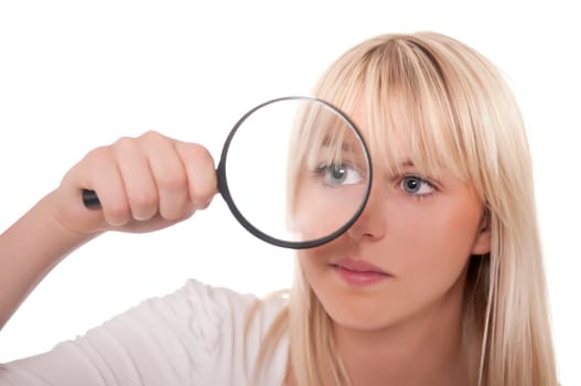 Blonde young woman with magnifying glass