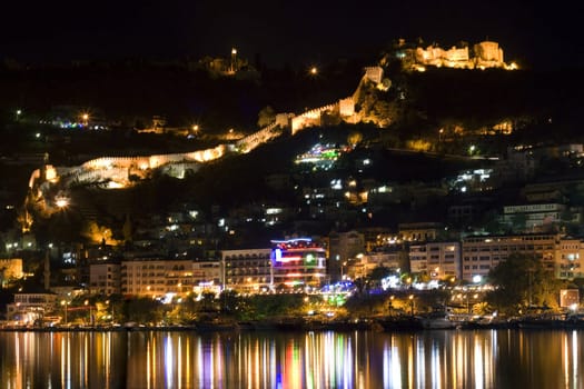 Night fortress, reflections of the torches
