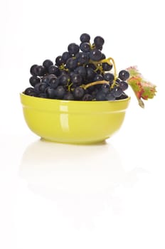 red grapes in green porcelain bowl