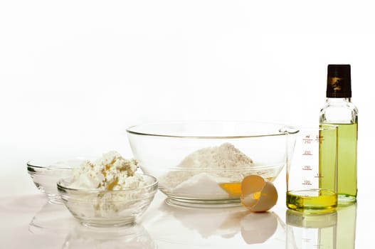 Ingredients for quark oil dough on white background