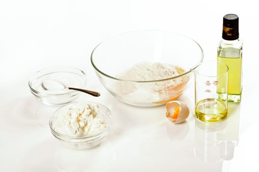 Ingredients for quark oil dough on white background