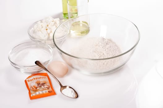 Ingredients for quark oil dough on white background