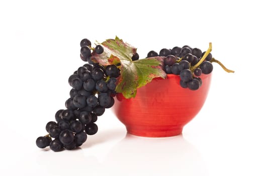 Red grapes in red porcelain bowl