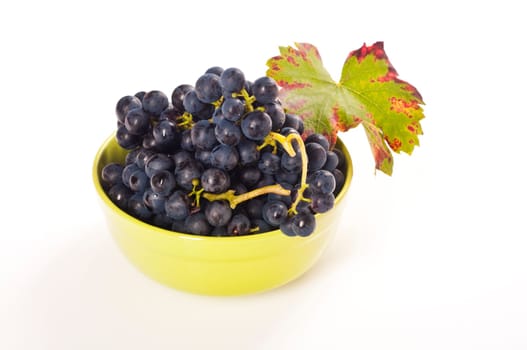 red grapes in green porcelain bowl