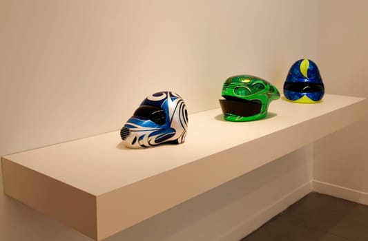 Istanbul, Turkey - June, 2011: Motor cycle helmets sculptures by Patricia Piccinini art show at Arter Gallery Hold me close to your Heart exhibition