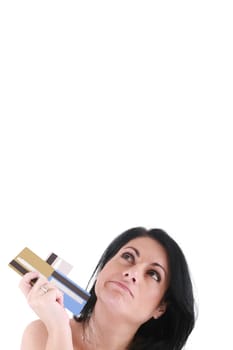 upset robed woman glaring at her many credit cards