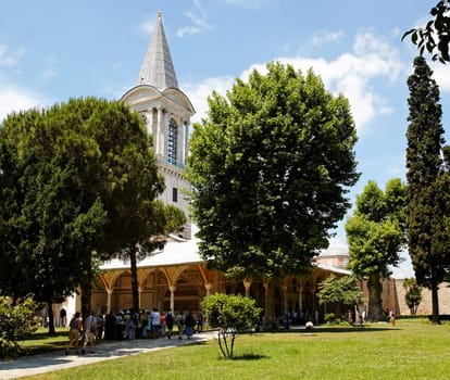 Sunny day with clouds and blue sky over pavillion and spire the former living quarters at the Topkapi Palace Istanbul, landscape, horizontal, crop area and copy space