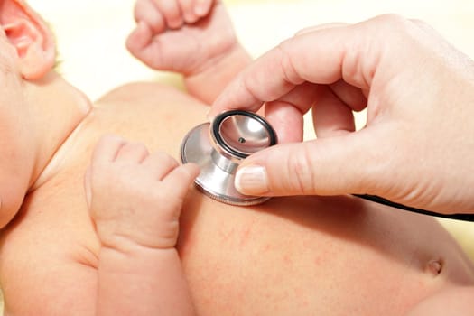Stethoscope listening to a baby&#039 s heart beat