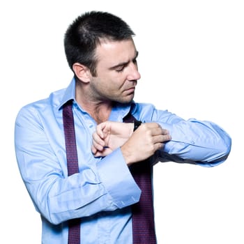 Portrait of a mature man fastening cuffs in studio isolated on white background