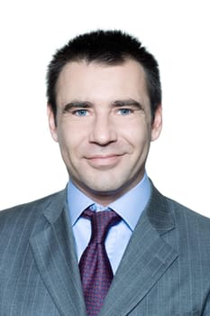 Closeup portrait of a smiling handsome man in studio on isolated white background