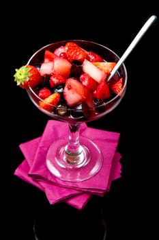 fresh fruit salad on black background