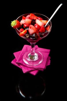 fresh fruit salad on black background
