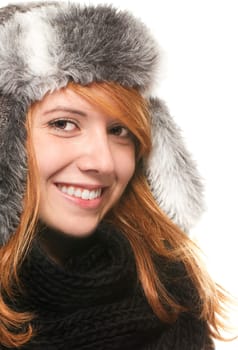 Portrait of smiling young rootharic woman in winter clothes against white background