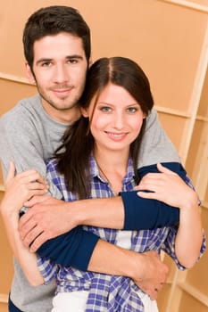 Home improvement young couple posing together in new house
