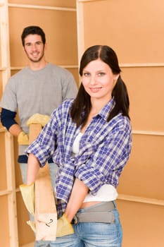 Home improvement young couple fixing house working on floor renovations