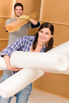 Home improvement young couple working on floor renovations