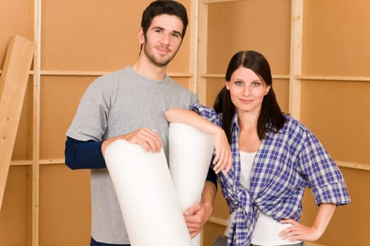 Home improvement young couple working on floor renovations