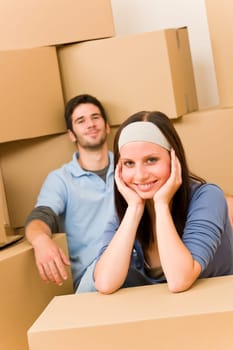 Moving into new home young happy couple sitting on floor