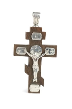 silver and wooden cross with religious inscriptions isolated on a white
