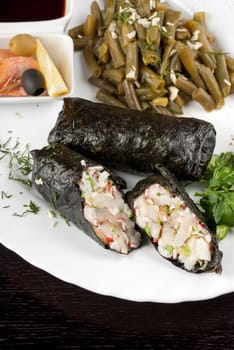 souffle of fillet of pikeperch, shrimps, crab meat, coconut and leek wrapped at nori garnished by string beans