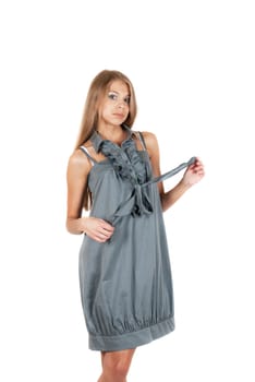 beautiful blonde woman wearing grey dress on a white