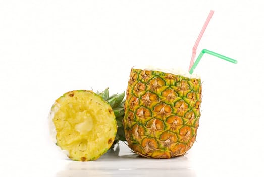 Milk cocktail with pineapple as cup on a white