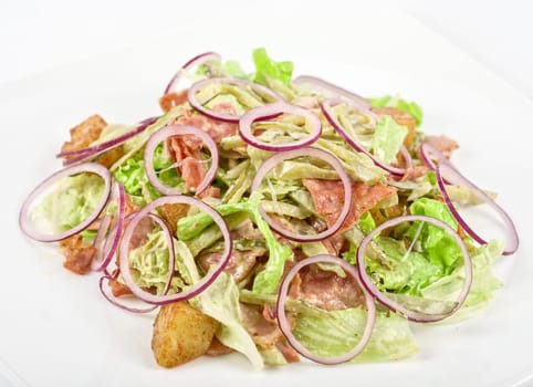 Onion salad of meat with roast vegetables